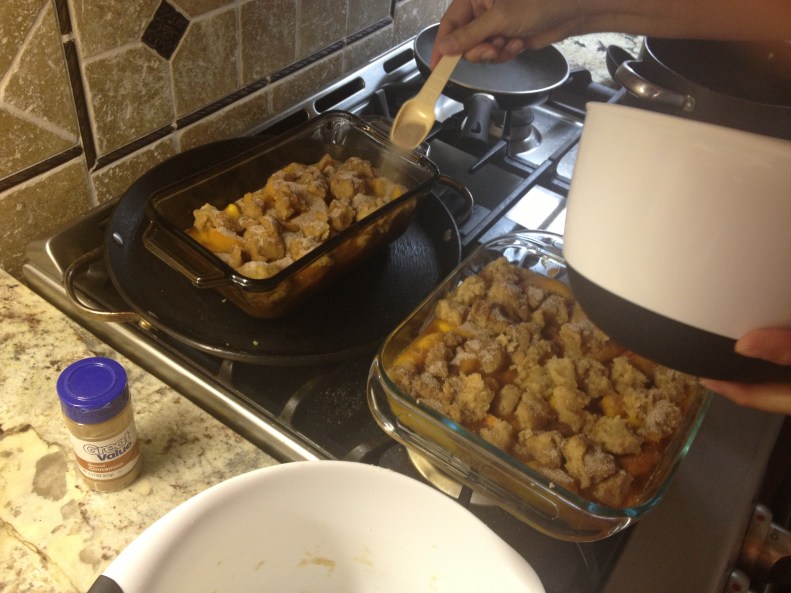 My mom adding the cinnamon sugar topping after I've added spoonfuls of the breading